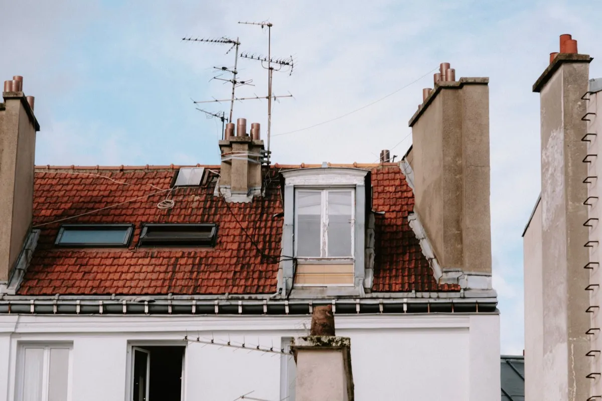 Chimneys and flashing details on a rooftop where leaks commonly begin in Jackson, MS